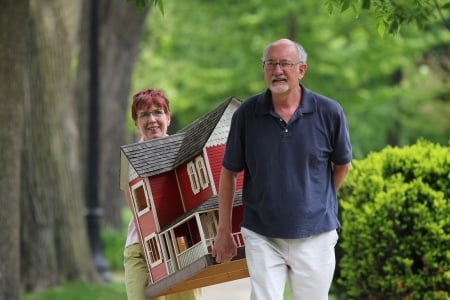 older couple carrying a suburban home in residential neighborhood
