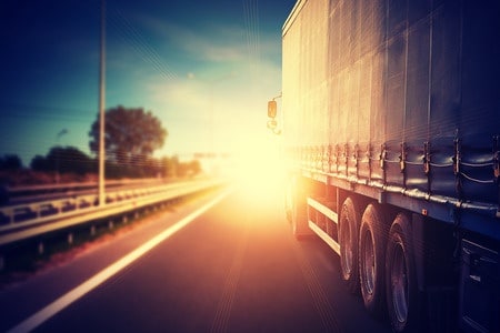 truck on the highway at sunset