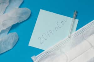Novel coronavirus disease called 2019-nCoV handwriting on blue paper