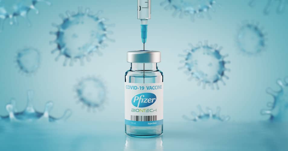 Pfizer Biontech Covid-19 Vaccine and injection syringe.