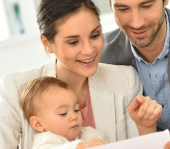 Young family reviewing documents